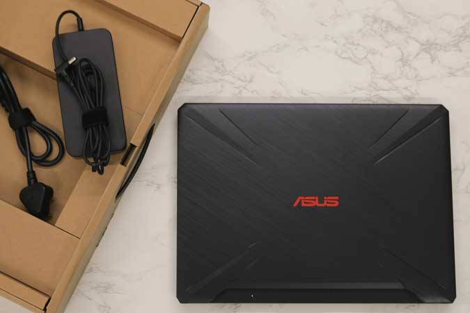 asus laptop with charging brick with box
