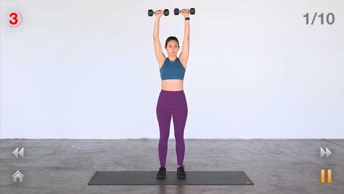 daily workouts- woman holding dumbells over her head