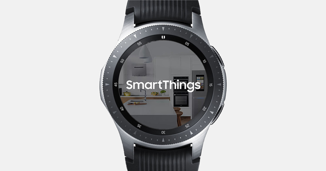 Screenshot of the Galaxy Watch with Smart things showing the App logo and a background of a home